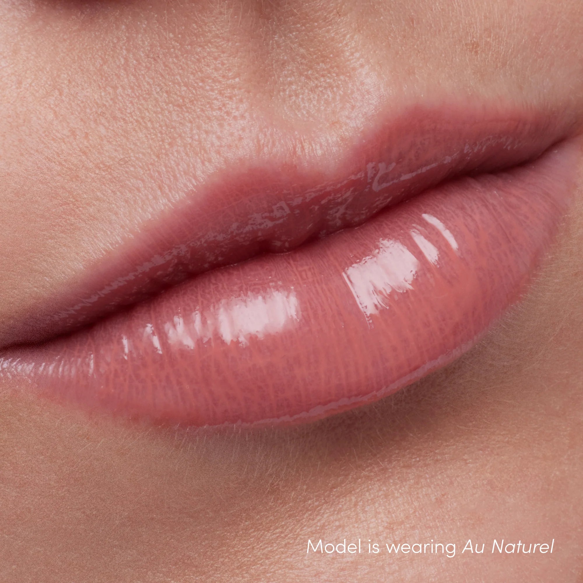How Colorluxe High Impact Lip Glaze - Shade Au Naturel look on the lips. Full-bodied, never-sticky lip glaze delivers lustrous color, supreme shine and a cushiony, comfortable feel. Visually volumizes and smooths for a fuller-looking lip. Monecious is a Jane Iredale Australian stockist. Shipping all over Australia.