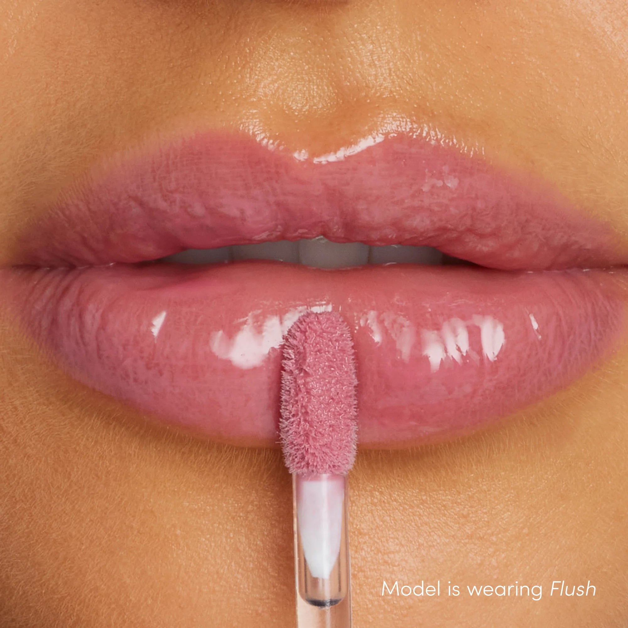 How Colorluxe High Impact Lip Glaze - Shade Flush look on the lips. Full-bodied, never-sticky lip glaze delivers lustrous color, supreme shine and a cushiony, comfortable feel. Visually volumizes and smooths for a fuller-looking lip. Monecious is a Jane Iredale Australian stockist. Shipping all over Australia.