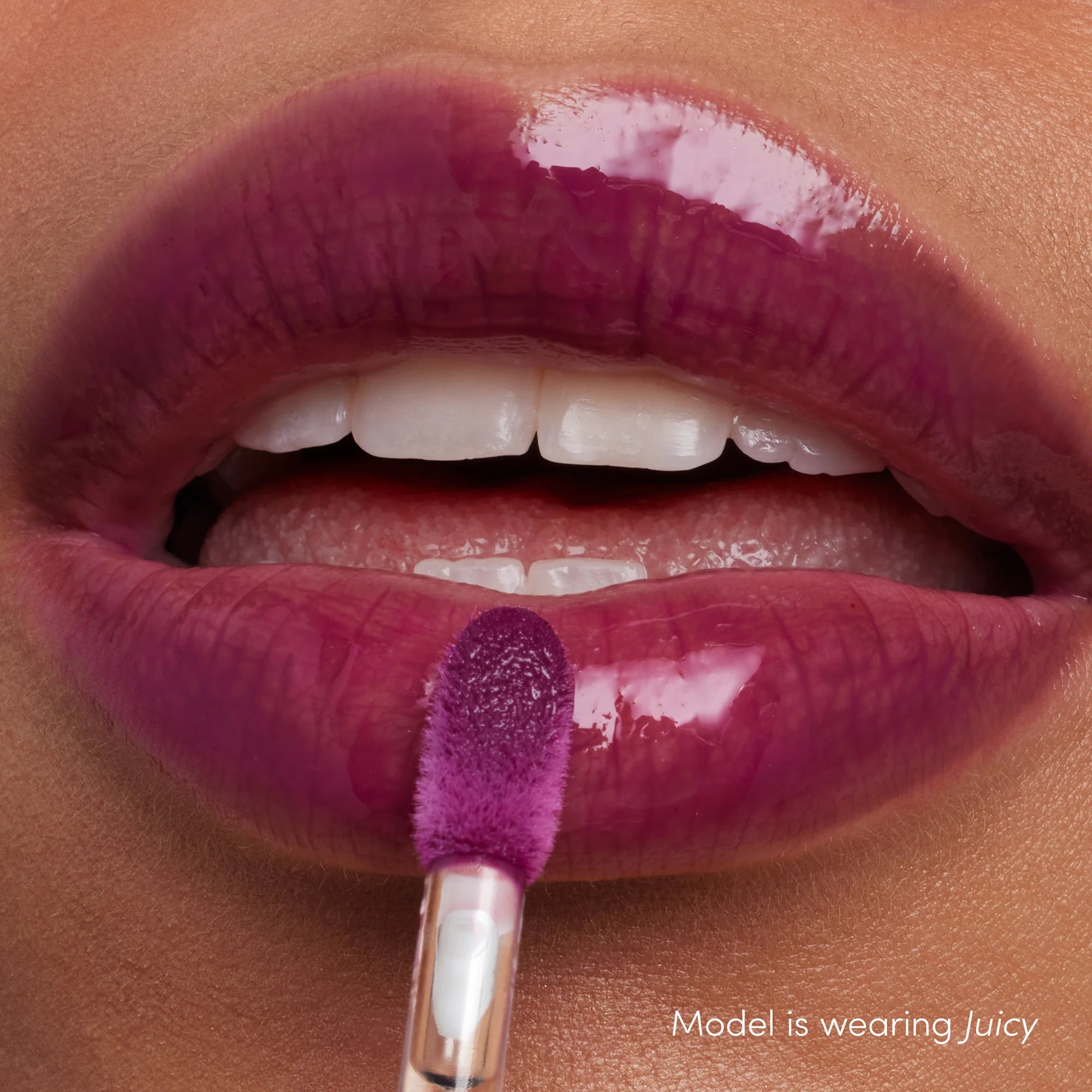 How Colorluxe High Impact Lip Glaze - Shade Juicy look on the lips. Full-bodied, never-sticky lip glaze delivers lustrous color, supreme shine and a cushiony, comfortable feel. Visually volumizes and smooths for a fuller-looking lip. Monecious is a Jane Iredale Australian stockist. Shipping all over Australia.