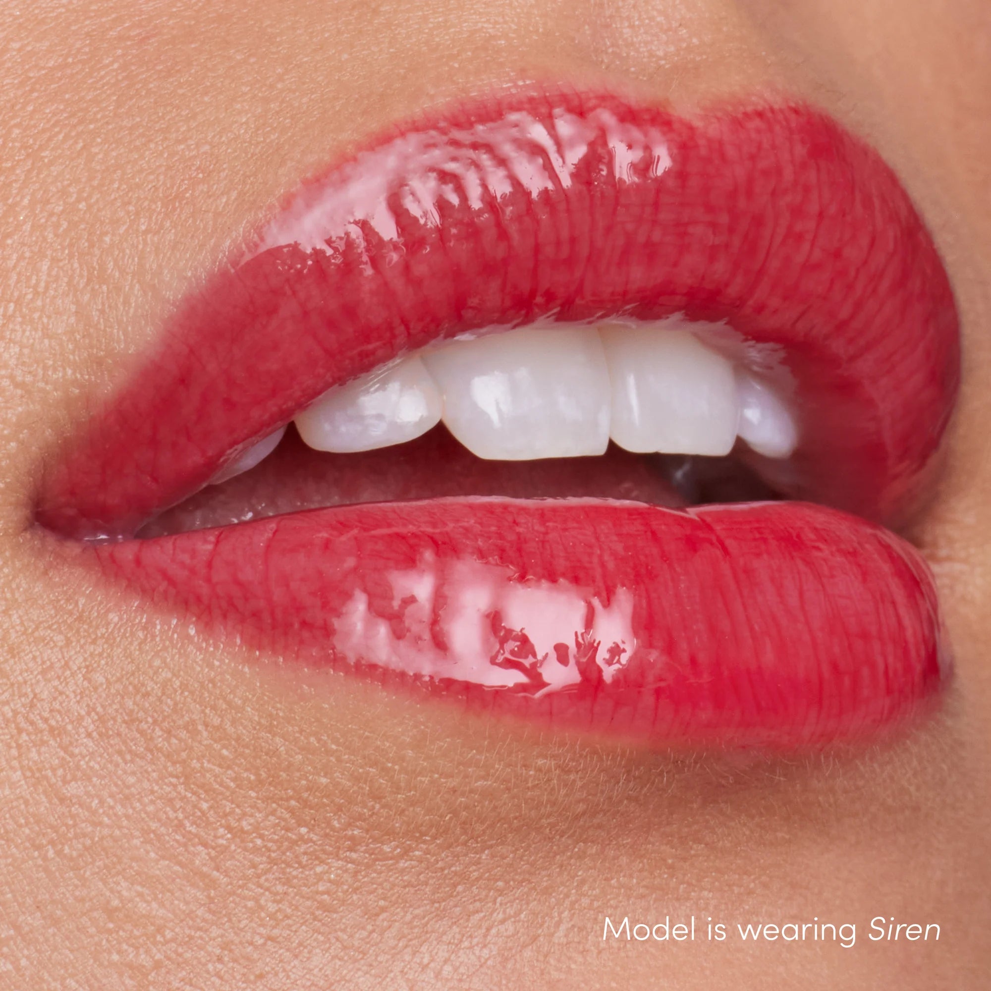 How Colorluxe High Impact Lip Glaze - Shade Siren look on the lips. Full-bodied, never-sticky lip glaze delivers lustrous color, supreme shine and a cushiony, comfortable feel. Visually volumizes and smooths for a fuller-looking lip. Monecious is a Jane Iredale Australian stockist. Shipping all over Australia.