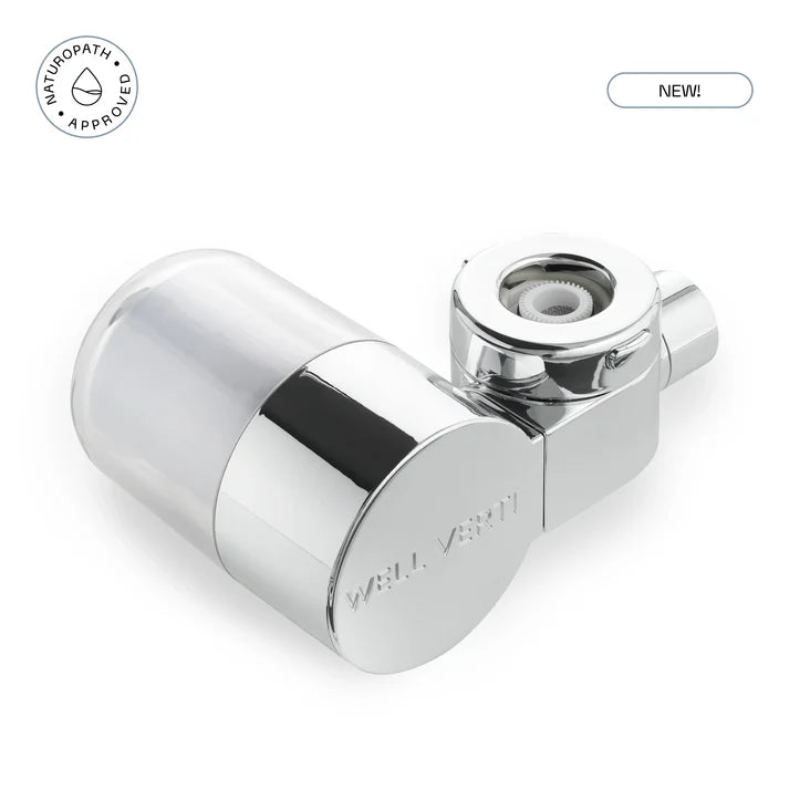 Chrome shower head with 'Naturopath Approved' and 'NEW!' labels. Ensure your water stays pure with the HaloDrop™ Tap Filter Refill. Quick-change cartridge designed to maintain elite filtration for skin and hair wellness. Monecious is a Well Verti Australian stockist. Shop now!