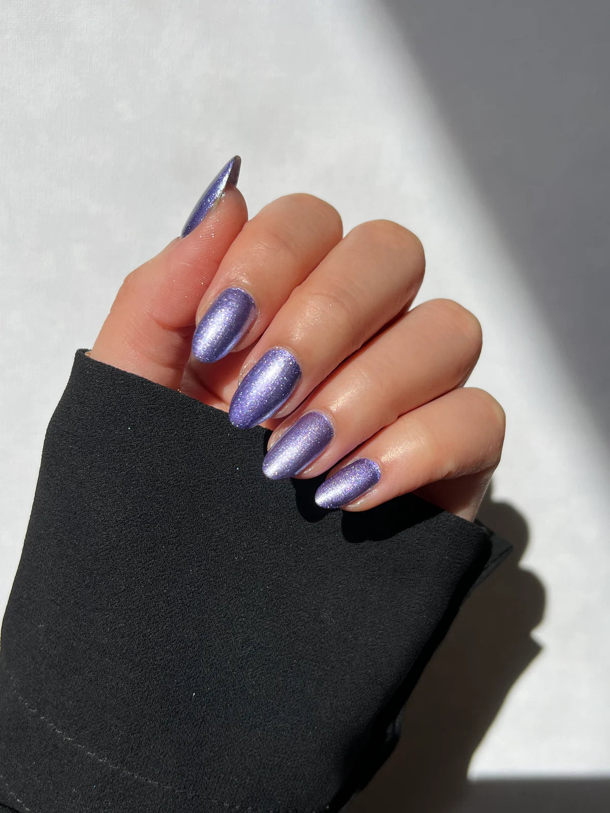 Hanami - Ultraviolet swatch. Shade Metallic purple. A soft, pearlescent nail polish that catches the light for a subtle glow. Ideal for elegant, everyday wear, this luminous finish enhances any colour with a delicate, radiant sheen. Hanami Australian stockist. Free Shipping for orders over $350. Shipping only in Australia. Shop now!