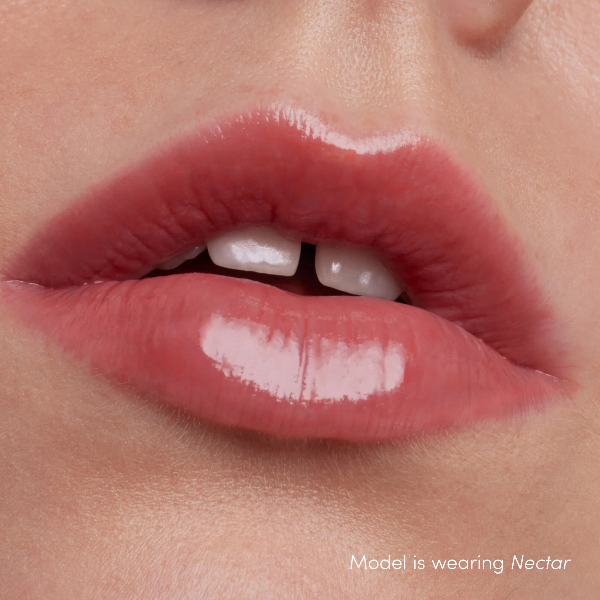 How Colorluxe High Impact Lip Glaze - Shade Nectar look on the lips. Full-bodied, never-sticky lip glaze delivers lustrous color, supreme shine and a cushiony, comfortable feel. Visually volumizes and smooths for a fuller-looking lip. Monecious is a Jane Iredale Australian stockist. Shipping all over Australia.