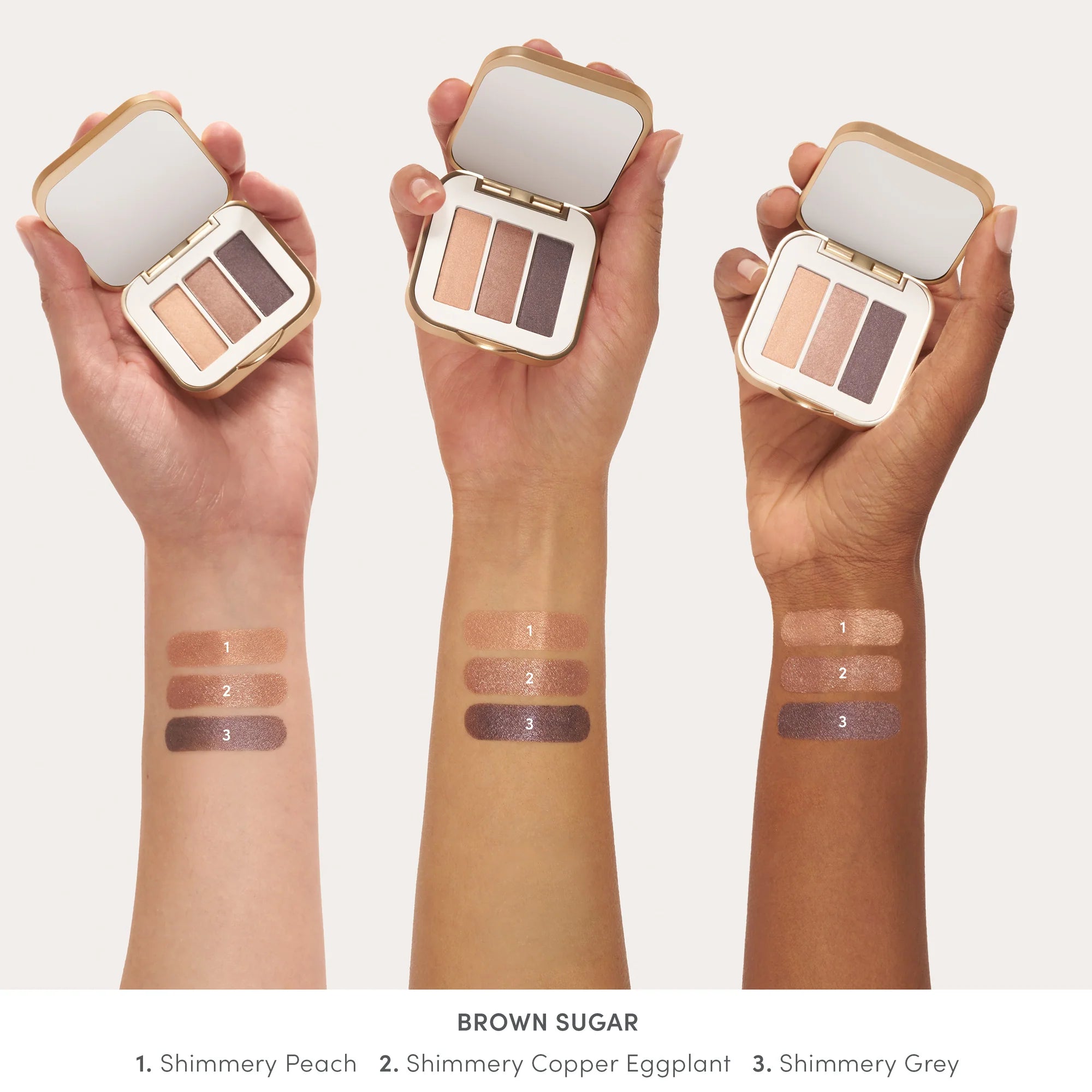 Jane Iredale's PurePressed® Eye Shadow Triple shade Brown Sugar - shimmery peach, shimmery copper eggplant, shimmery grey swatch
