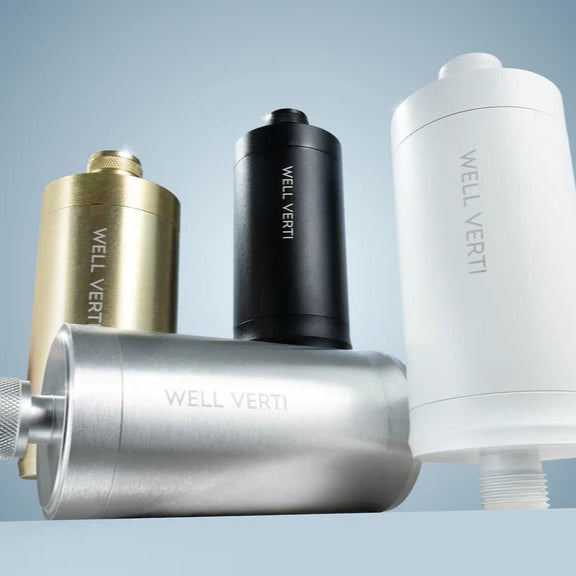 Four WELL VERTI water filter cartridges on a light blue background with media outlets' logos.