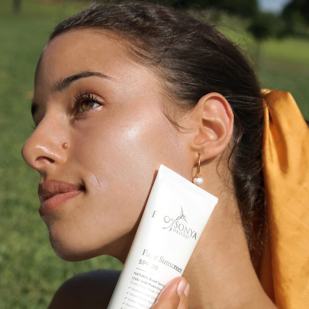 Ecotan's Face Sunscreen SPF 30 - a girl holding a sunscreen product